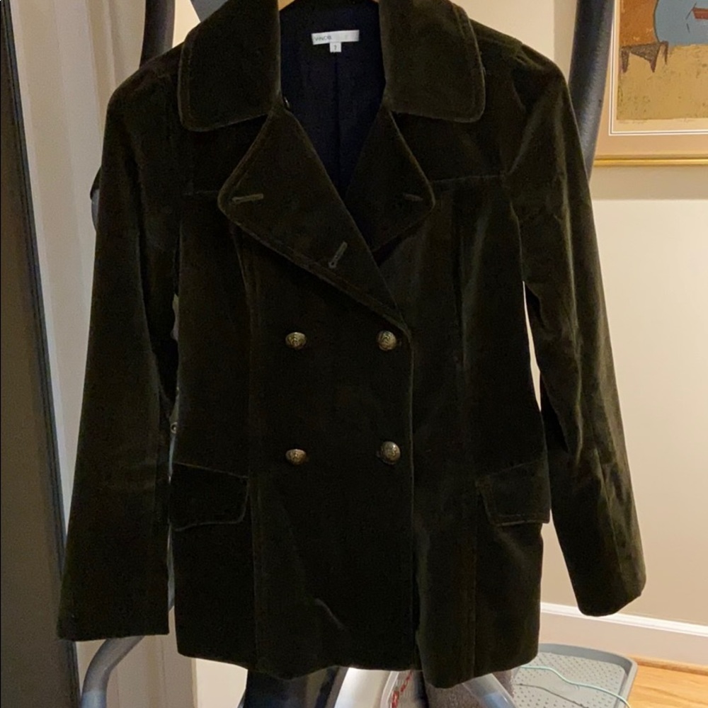 Vince, dark  green jacket.